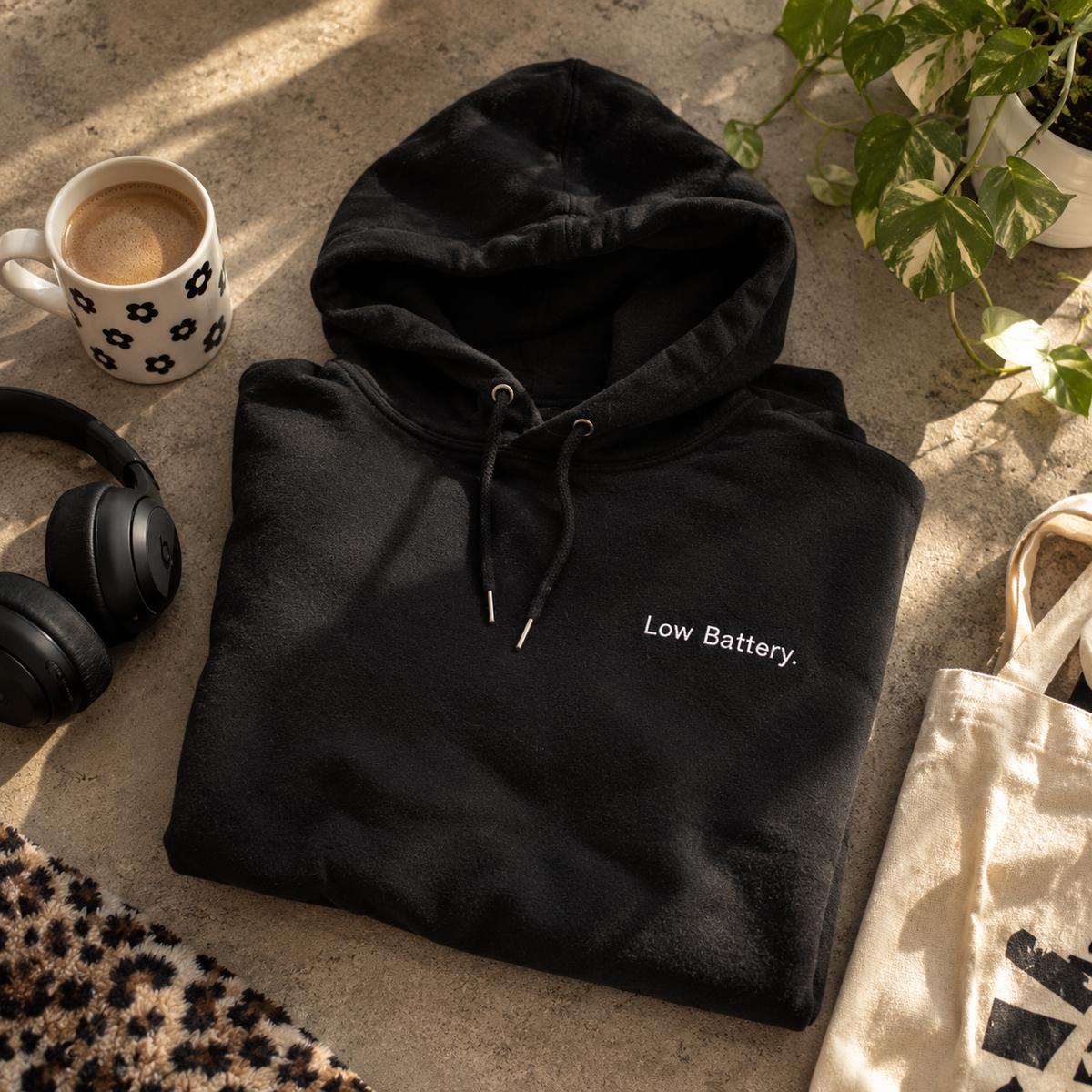 Black Low Battery. embroidered hoodie folded flat