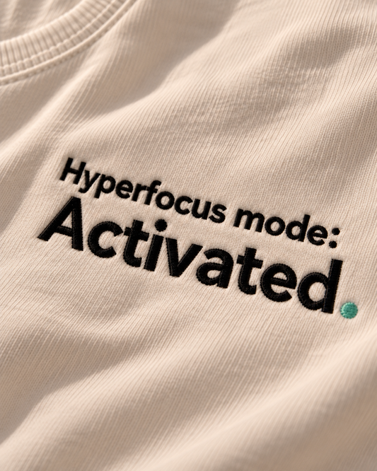 Close-up of the Hyperfocus mode: Activated. embroidery on Vintage White fabric