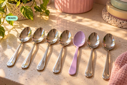 A row of matching silver spoons with one bright lilac spoon — cover for “The Wrong Spoon Theory — Why “Just Grab Any Spoon” Doesn’t Work for Us”