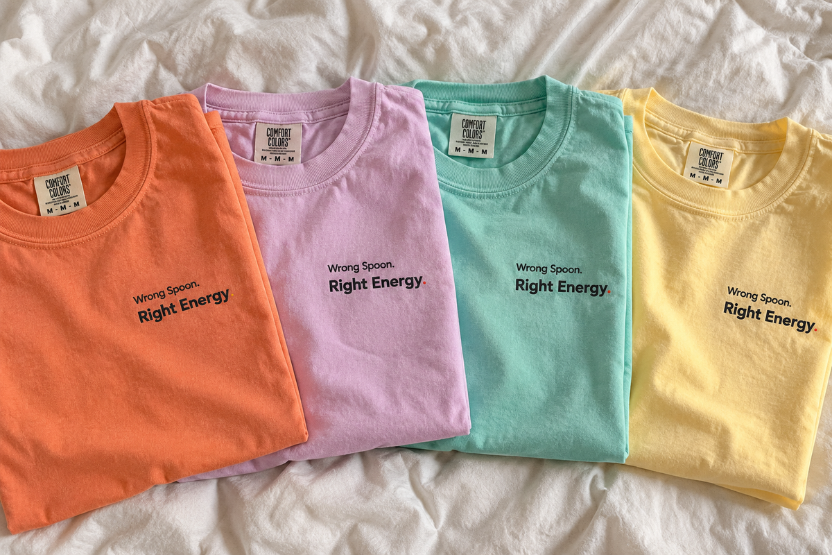 Wrong Spoon. Right Energy. Pastel Pop tees laid flat in Terracotta, Orchid, Chalky Mint and Butter