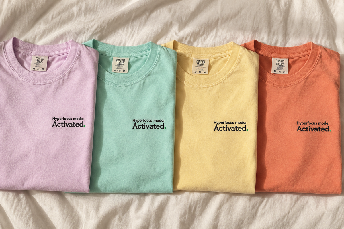 Hyperfocus mode: Activated. Pastel Pop tees laid flat in Orchid, Chalky Mint, Butter and Terracotta
