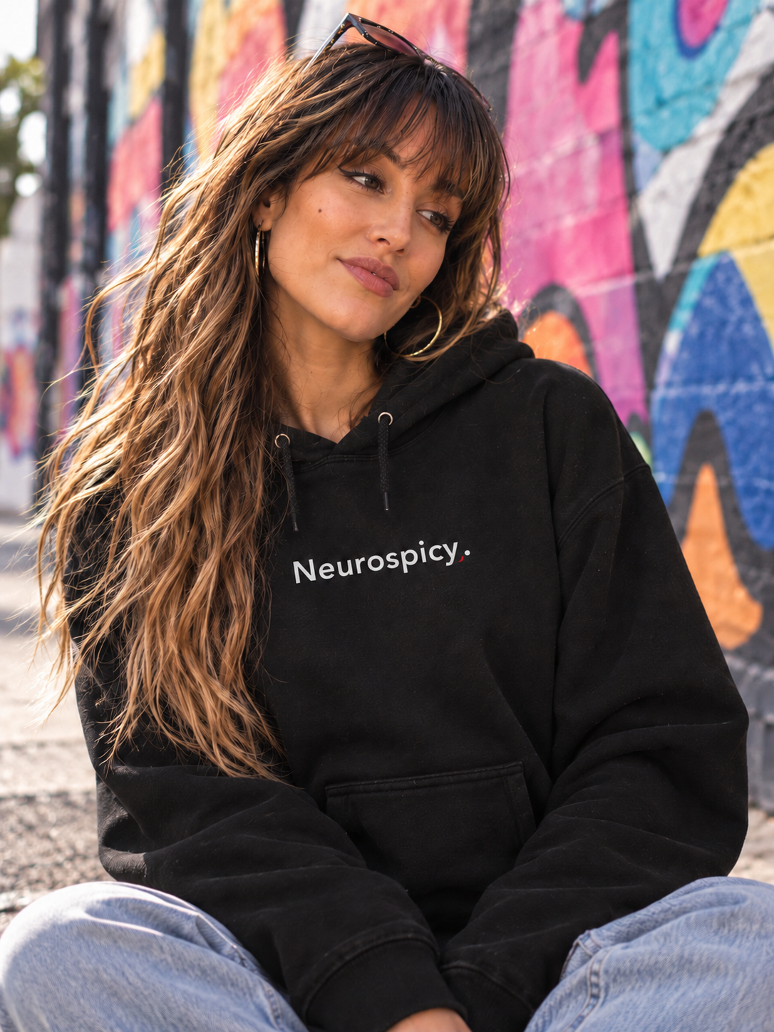 Woman wearing the black Neurospicy. hoodie