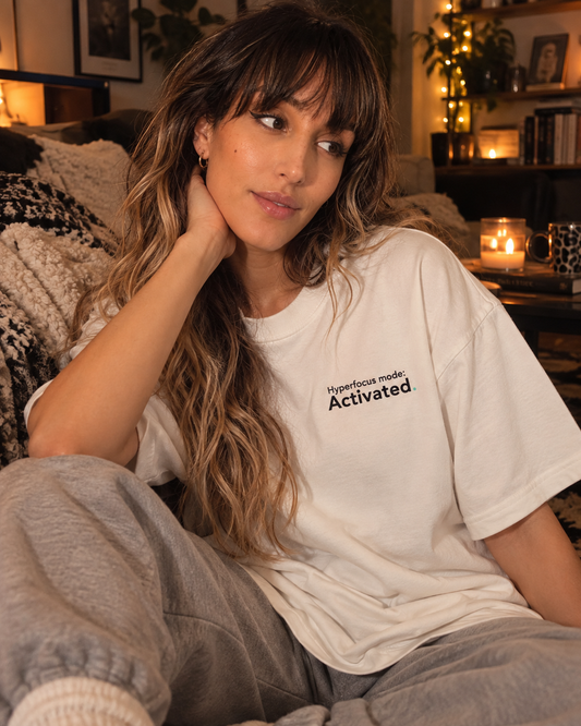 Woman wearing the Hyperfocus mode: Activated. embroidered oversized tee in Vintage White