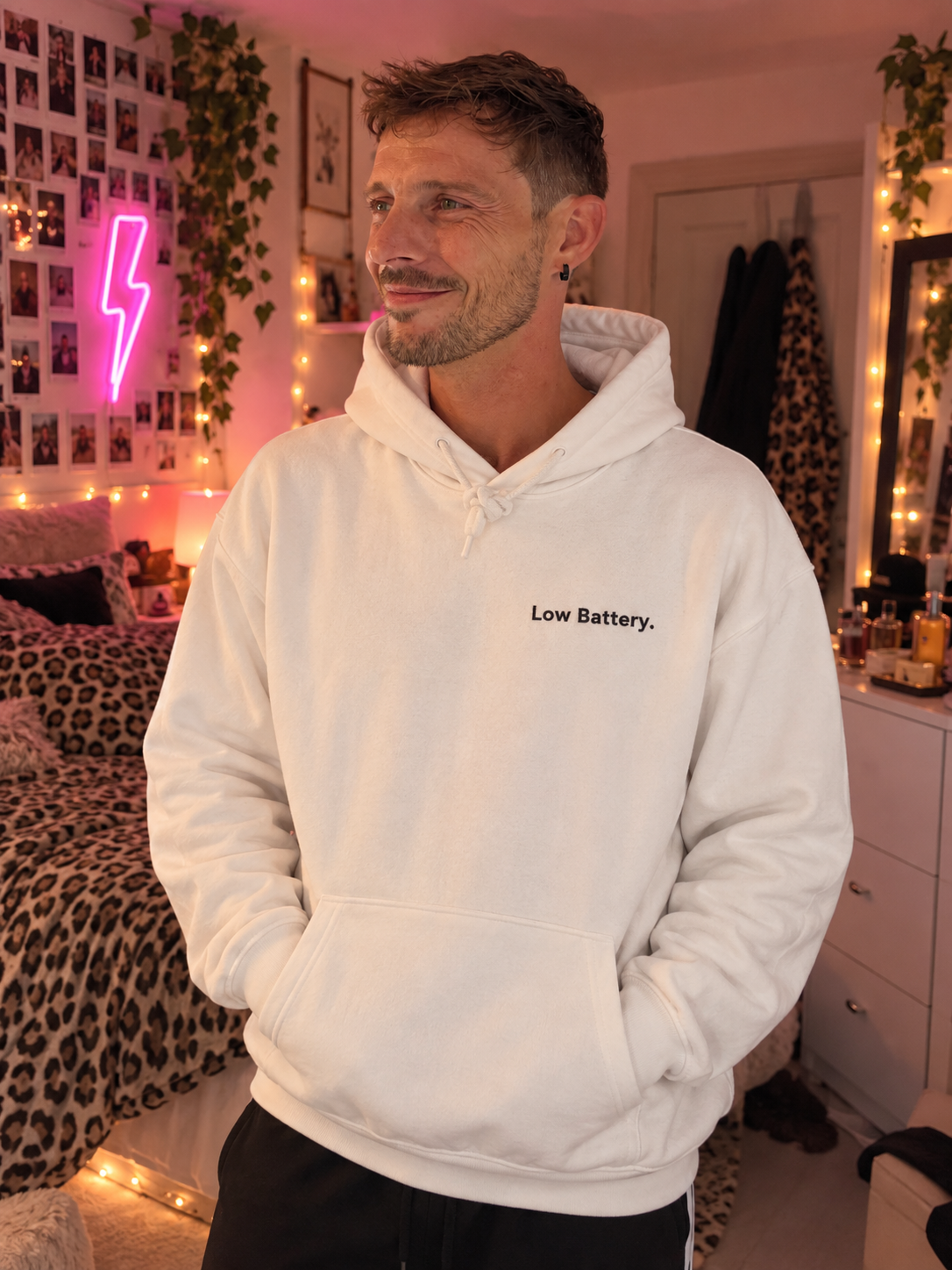 Man wearing the Low Battery. embroidered hoodie in White