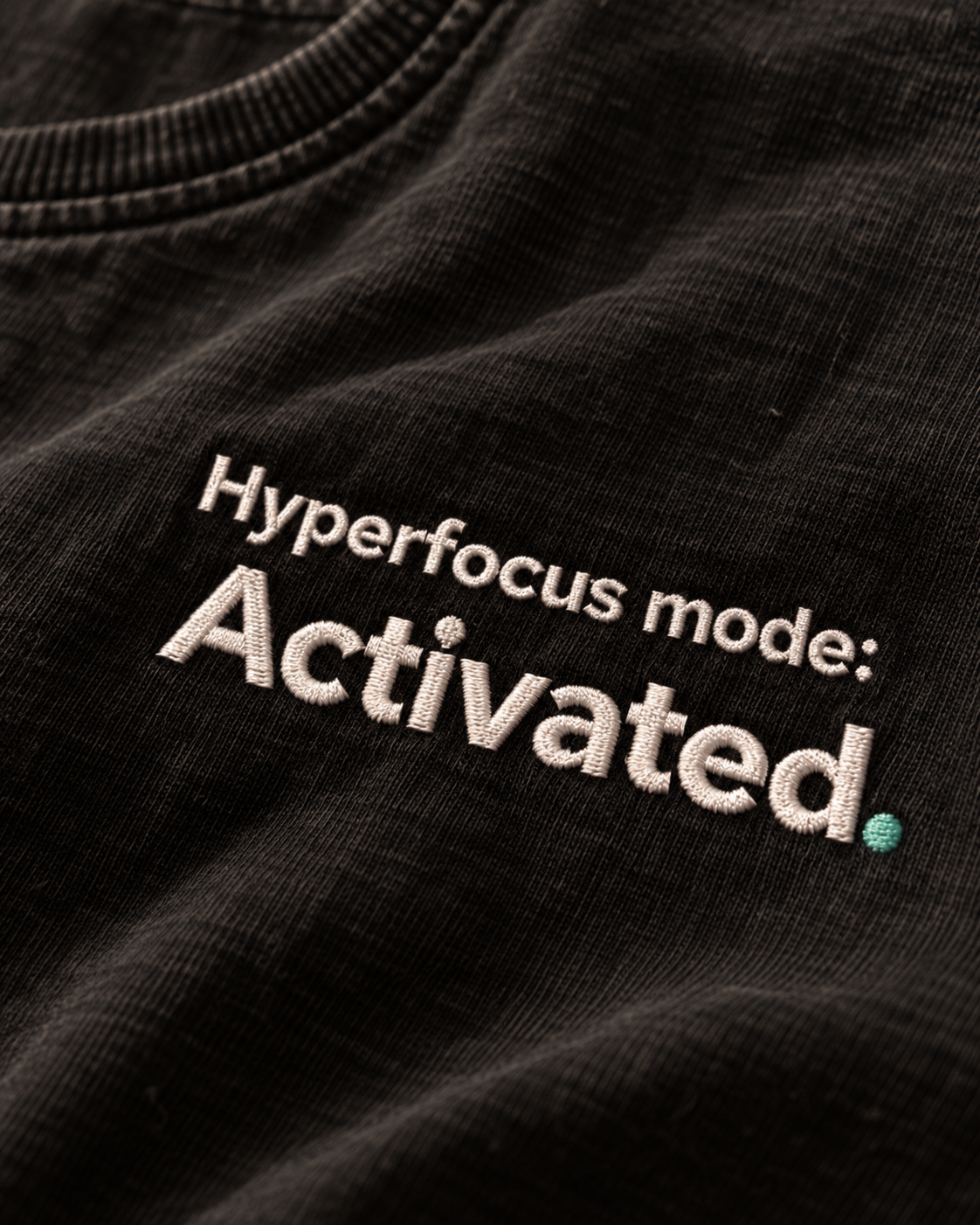 Close-up of the Hyperfocus mode: Activated. embroidery on Washed Black fabric