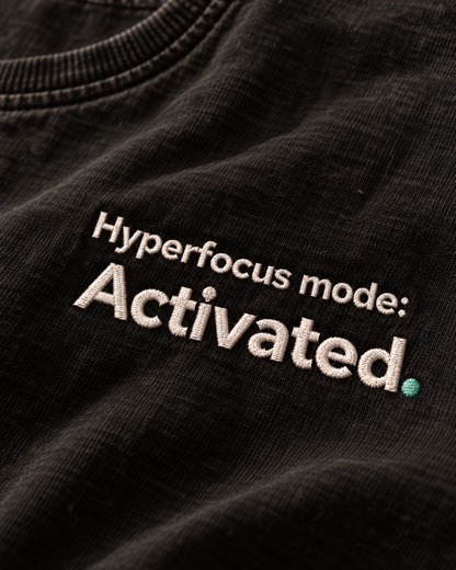 Close-up of the Hyperfocus mode: Activated. embroidery on Washed Black fabric