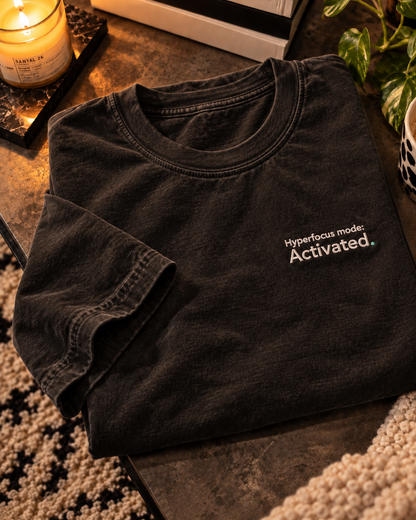 Hyperfocus mode: Activated. embroidered oversized tee in Washed Black, folded