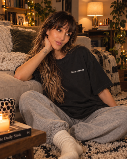 Woman wearing the Neurospicy. embroidered oversized tee in Washed Black