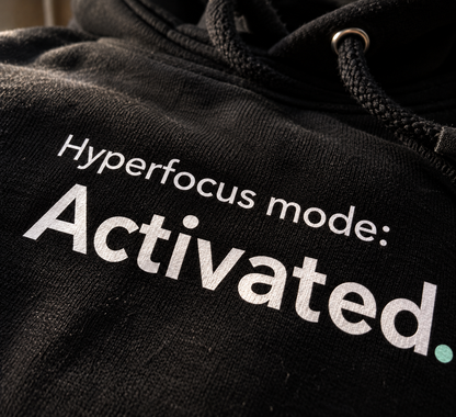 Close-up of the Hyperfocus mode: Activated. chest print on the black hoodie