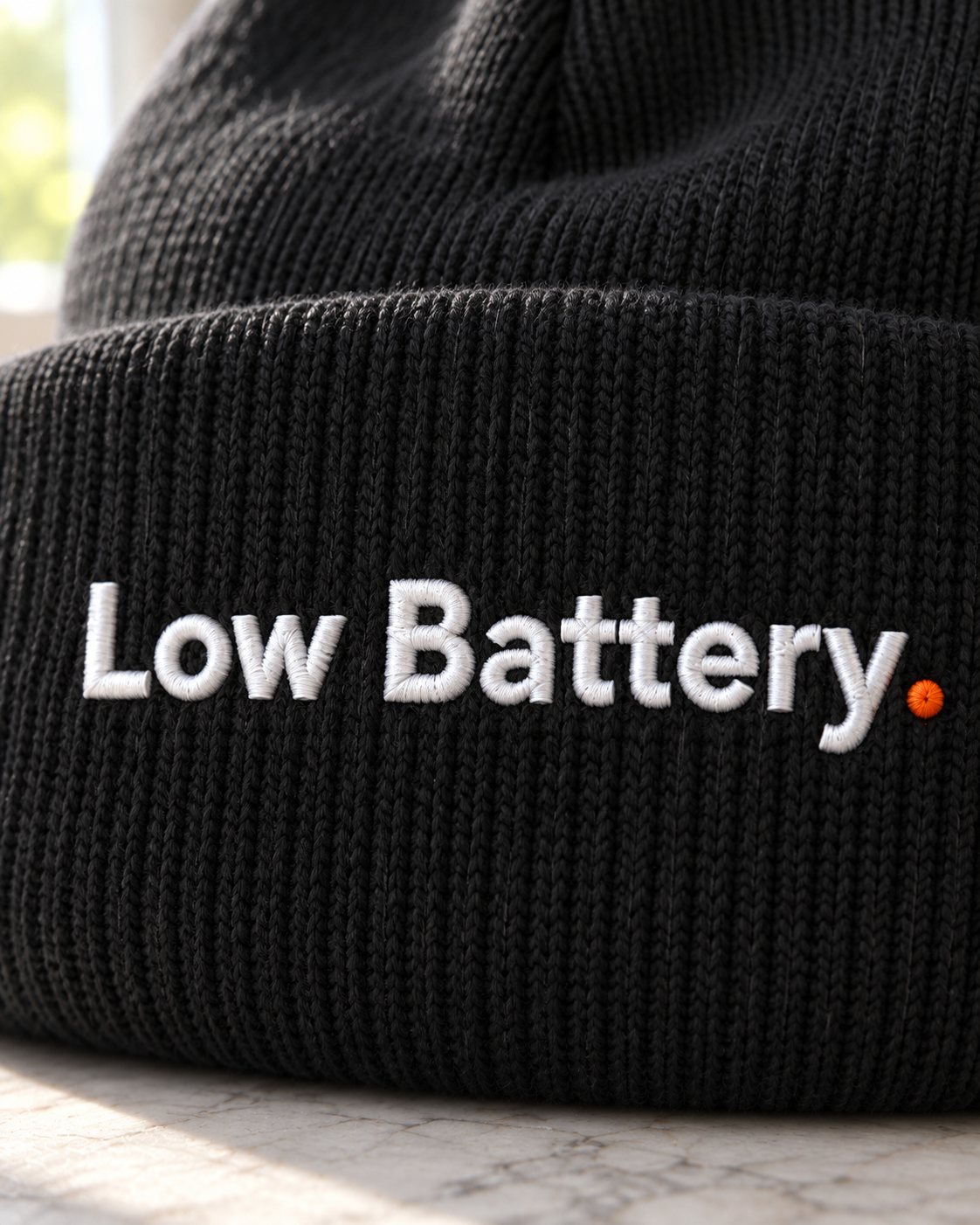Close-up of the Low Battery. embroidery on the beanie cuff