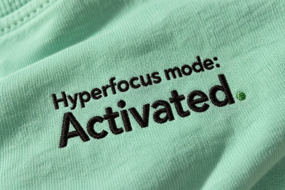 Close-up of the Hyperfocus mode: Activated. embroidery on Chalky Mint fabric