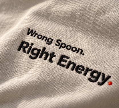 Close-up of Wrong Spoon. Right Energy. embroidery on Vintage White fabric