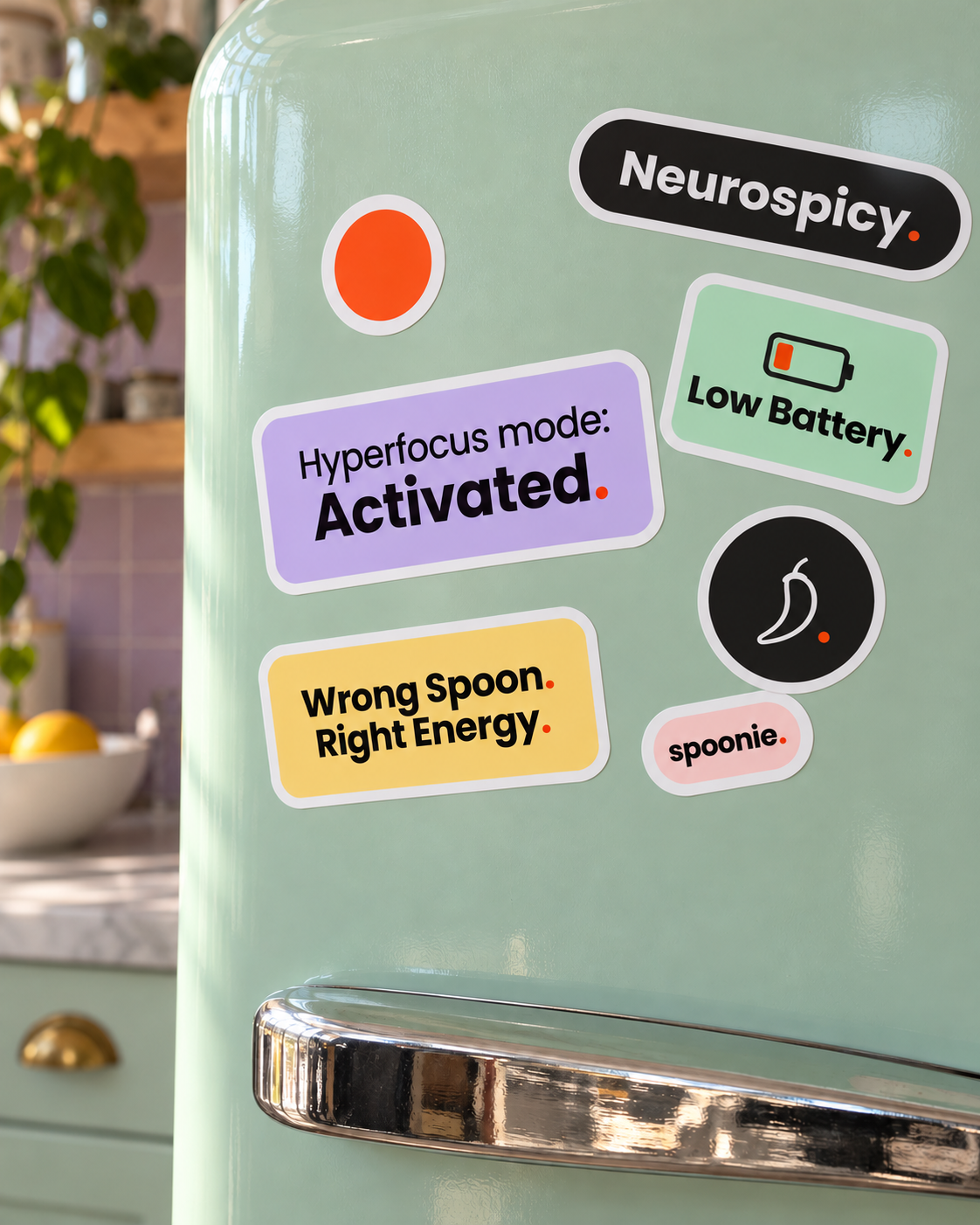 All seven Wrong Spoon stickers stuck on a mint fridge door