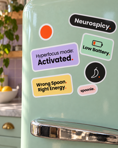 All seven Wrong Spoon stickers stuck on a mint fridge door