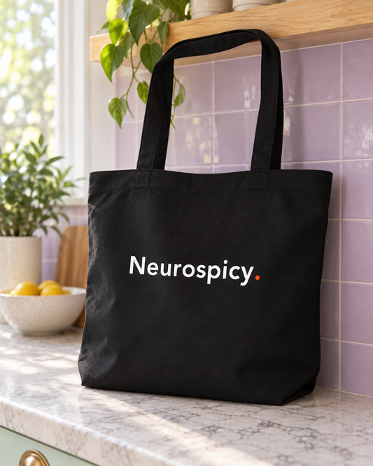Black Neurospicy. tote bag standing on a pastel kitchen counter, front view