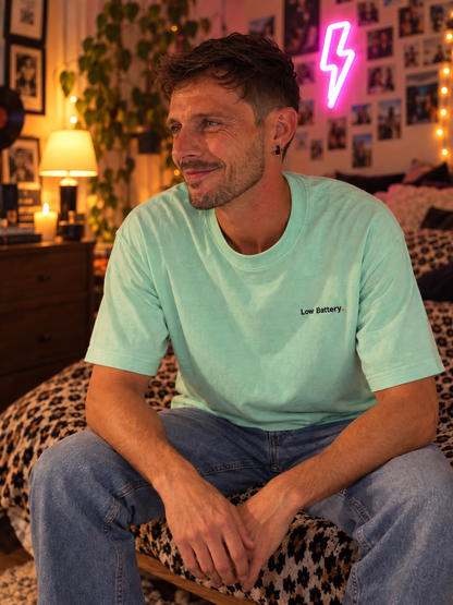 Man wearing the Low Battery. embroidered Pastel Pop tee in Chalky Mint