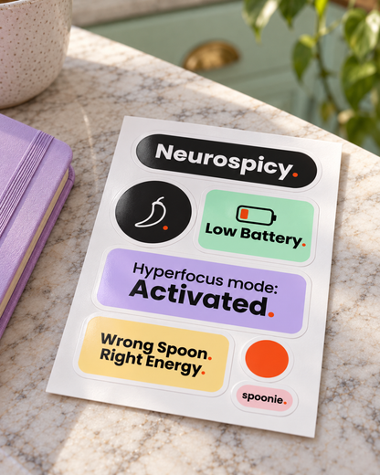 The Wrong Spoon Co. sticker sheet lying on a marble kitchen counter