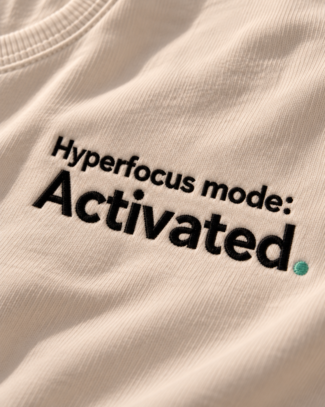 Close-up of the Hyperfocus mode: Activated. embroidery on Vintage White fabric