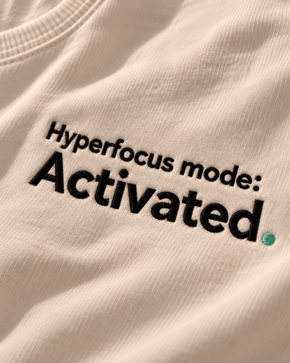 Close-up of the Hyperfocus mode: Activated. embroidery on Vintage White fabric