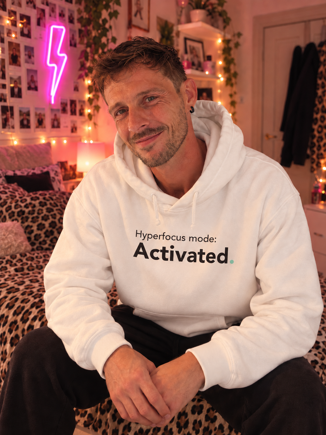 Man wearing the white Hyperfocus mode: Activated. hoodie