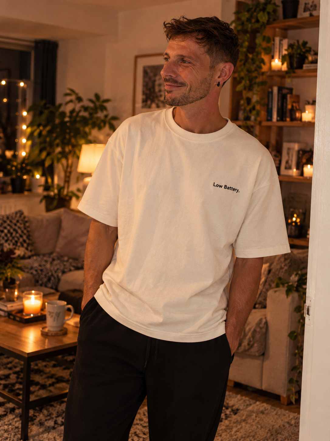 Man wearing the Low Battery. embroidered oversized tee in Vintage White